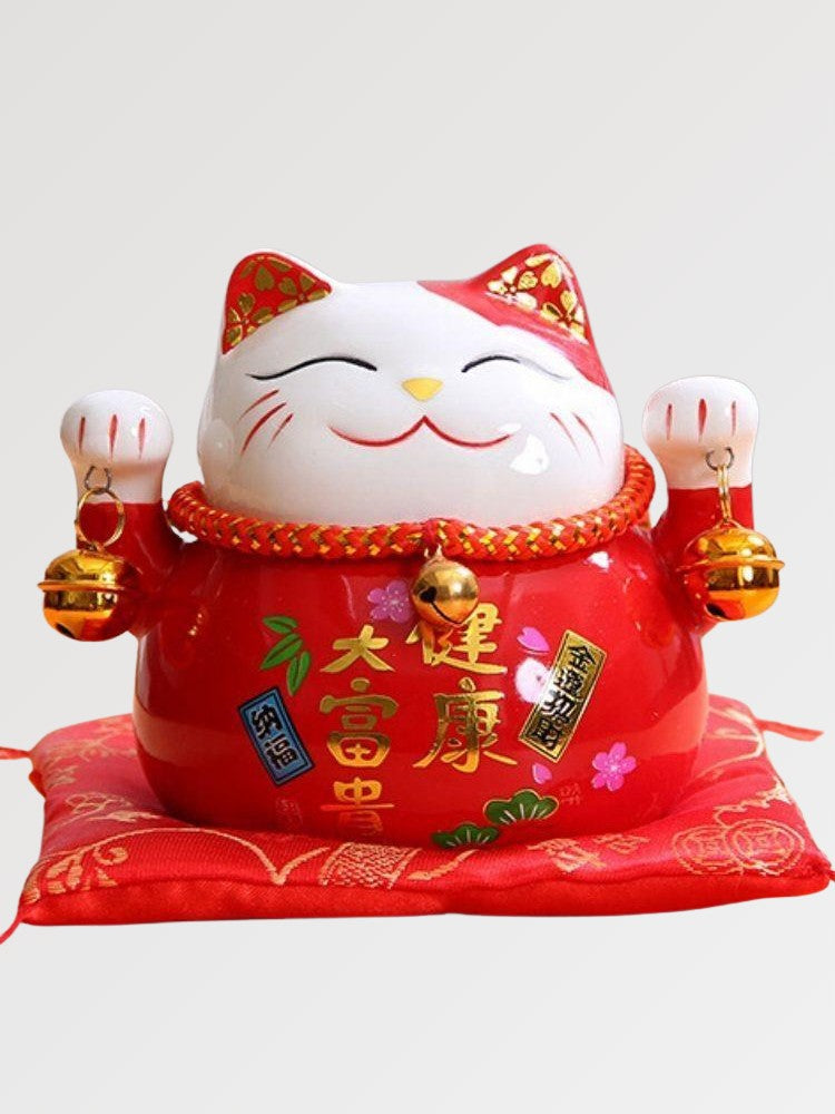 Japanese-style red maneki neko figurine
