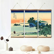 Japanese triptych painting of a traditional village