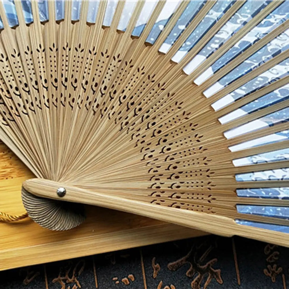 Close-up of japanese folding fan with wave print fabric and craftsmanship