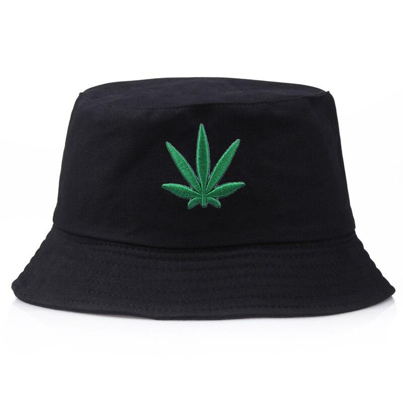 Detail of embroidered green leaf on black cotton bucket hat — Tokyo botanical streetwear, supreme bucket hats alternative