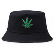Detail of embroidered green leaf on black cotton bucket hat — Tokyo botanical streetwear, supreme bucket hats alternative
