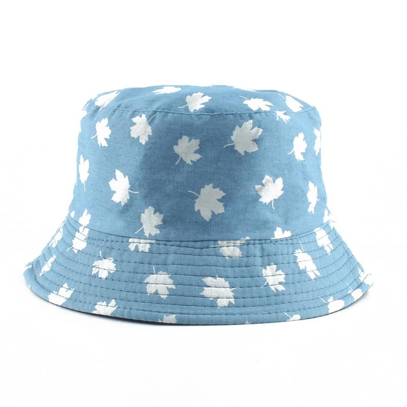 Detail of white maple leaves on blue cotton bucket hat — Japanese momiji streetwear, kangol blue bucket hat alternative