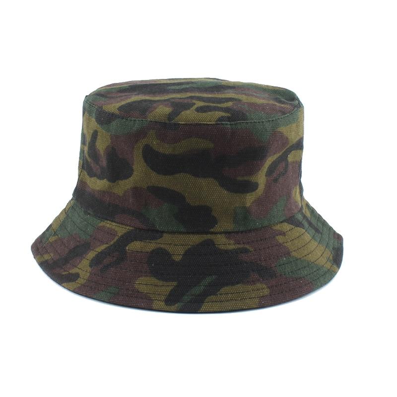 Detail of woodland camo print on cotton bucket hat — Tokyo militaria streetwear, supreme camo bucket hat alternative