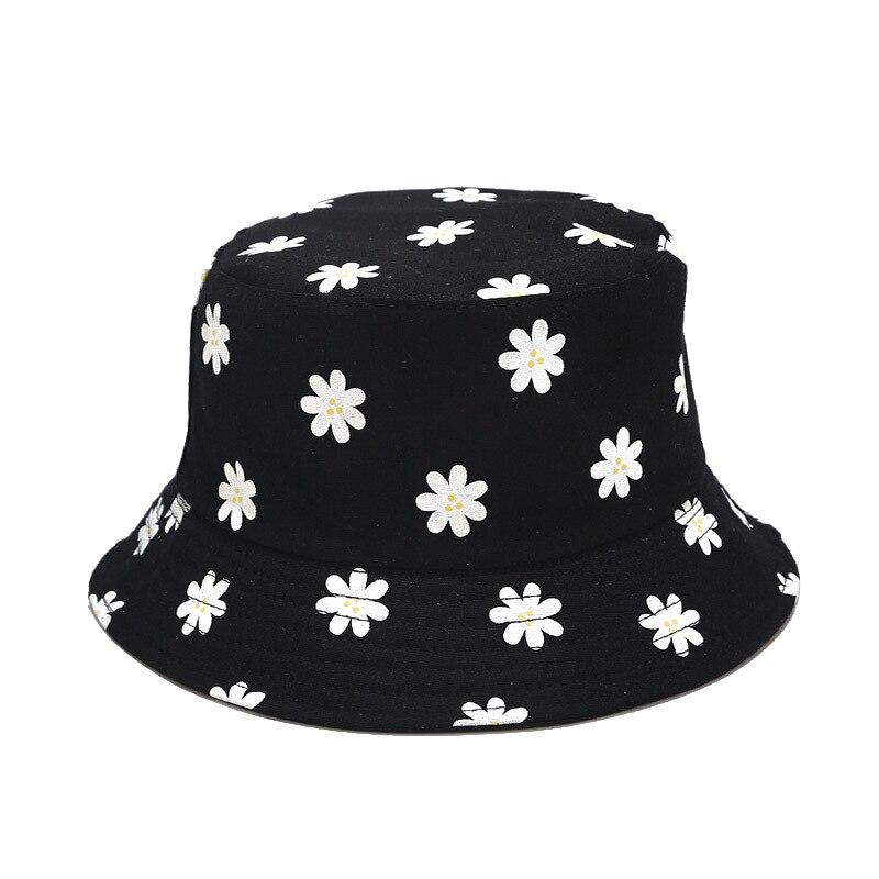 Detail of white daisy print on black cute bucket hat — Y2K Tokyo cotton, jacquemus floral bucket hat alternative