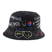 Detail of hand-drawn graffiti print on white cotton bucket hat — Seoul streetwear, jordan graffiti bucket hat alternative