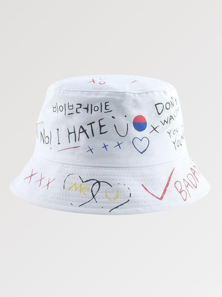 White graffiti bucket hat with hand-drawn doodle print — Tokyo Seoul cotton, ader error graffiti bucket hat alternative