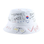Detail of hand-drawn graffiti print on white cotton bucket hat — Seoul streetwear, jordan graffiti bucket hat alternative