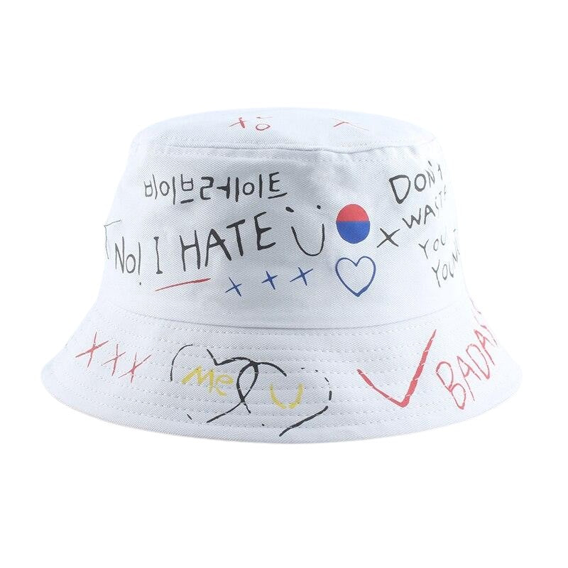 Detail of hand-drawn graffiti print on white cotton bucket hat — Seoul streetwear, jordan graffiti bucket hat alternative