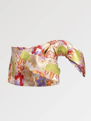 Ivory and gold brocade obi belt with large green leaves, violet and red flowers and golden fans, flat product view showing the full sash and knot