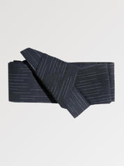 Deep navy-black obi belt flecked with fine pale gray dashes, flat product view showing the full sash and knot