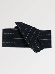 Deep navy obi belt ruled with crisp white stripes, flat product view showing the full sash and knot