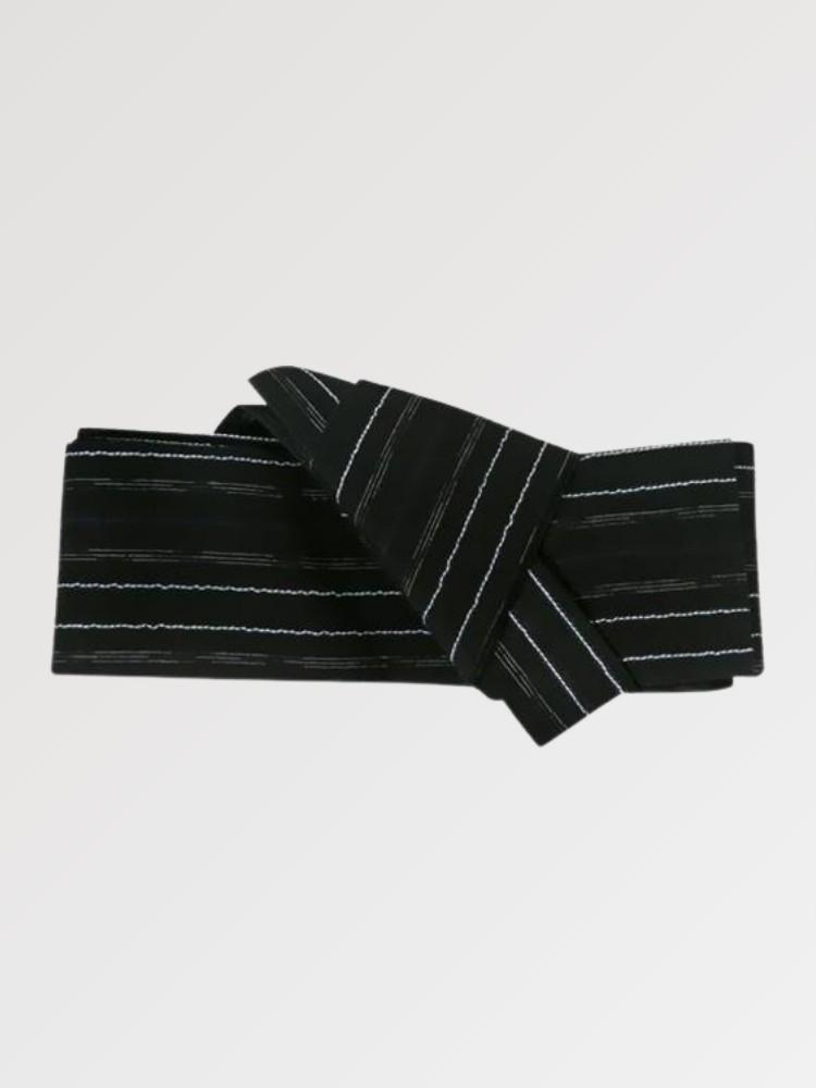Black obi belt rippling with wavy white lines tinged with blue, flat product view showing the full sash and knot