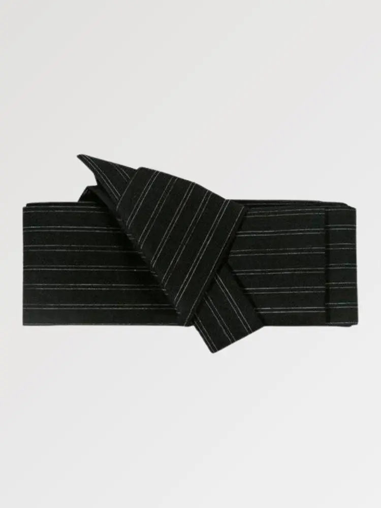 Solid black obi belt with loosely spaced gray-white stripes, flat product view showing the full sash and knot