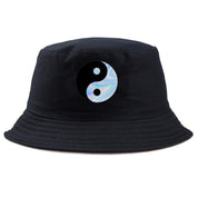 Detail of holographic yin yang patch on black bucket hat — iridescent streetwear, prada bucket hat alternative